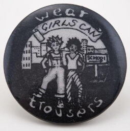 Button. 'Girls can wear trousers'