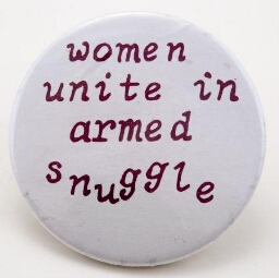 Button. 'Women unite in armed snuggle'